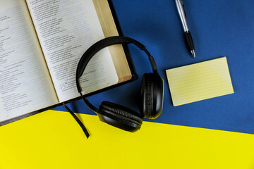 Wall Mural - Holy Bible with headphones - symbol of listening to the Word of God