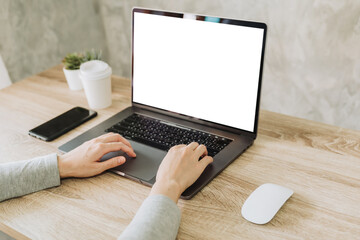 Wall Mural - woman using laptop and working on wooden table