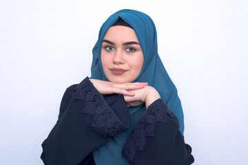 Portret of young muslim teenager arab girl with hijab on white background