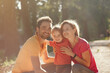 © hetmanstock2 - Family with cute little daughter. Father in a yellow t-shirt. People walks in a park.