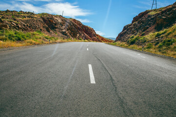 Wall Mural - asphalt road and rocks