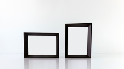 Portrait and Landscape Two Black Painted Wooden Picture Frames