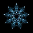Snowflake pattern isolated on black background. Kaleidoscope effect.