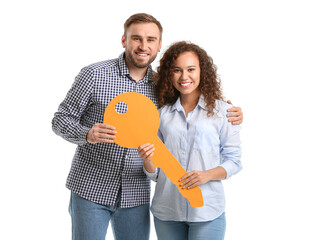 Sticker - Happy young couple with big paper key on white background