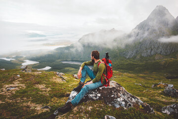 Wall Mural - Man hiker exploring mountains of Norway Travel healthy lifestyle adventure trip hiking solo with backpack active vacations outdoor