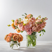 A Wedding Bouquet Of Lisianthus, Antirrhinum And Various Varieties Of Eucalyptus In A Glass Vase On The Kitchen Table.
