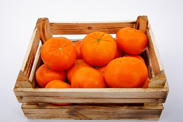 View of fresh mandarins in wooden crate