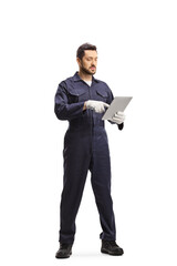 Wall Mural - Full length portrait of an auto mechanic using a tablet