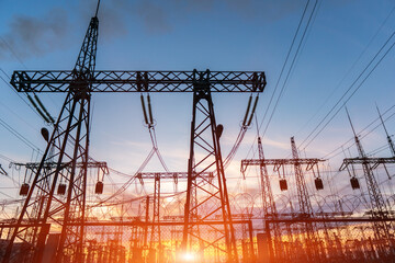 Wall Mural - high-voltage power lines at sunset or sunrise. high voltage electric transmission tower
