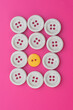 © Ahmad - Set of buttons,isolated over pink background,shot from high angle