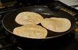 © jesus - Frying tortillas for homemade food