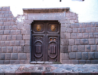 Colonial door in the middle of a stone wall