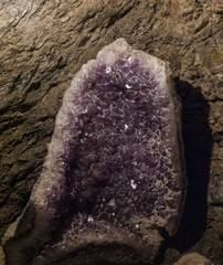 Violet Crystal Stone macro mineral. Purple rough Amethyst quartz crystals geode