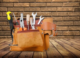 Wall Mural - Leather bag with set of tools on desk
