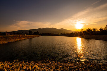 Poster - Reservoir with mountain view at sunset