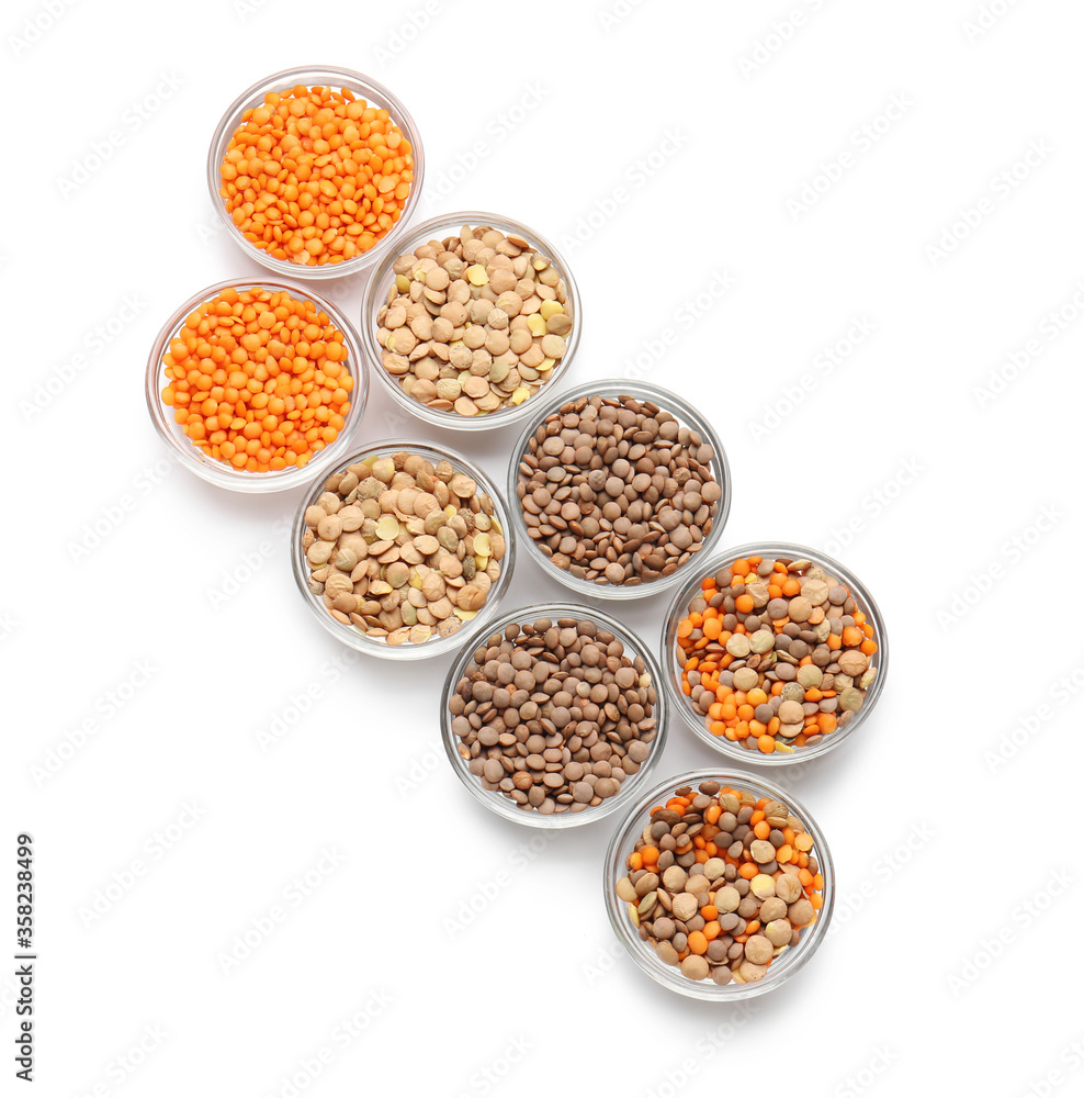 Bowls with lentils on white background