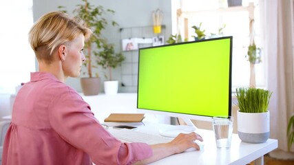 Poster - Businesswoman with computer working indoors in office, keyable screen.