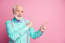 Photo Of Cool Stylish Look Aged Man Guy Indicating Fingers Empty Space Offer Black Friday Low Prices Wear Mint Shirt Suspenders Violet Bow Tie Isolated Pastel Pink Color Background