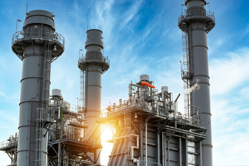 Close up Industrial view Chimney of Power plant for Industrial Estate form industry zone with sunrise and cloudy sky