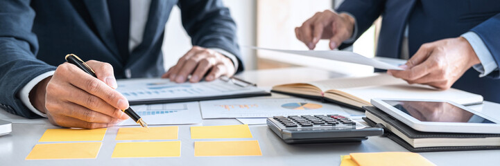 Fototapete - Business team discussing working analyzing with financial data

