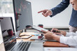 © Freedomz - Business team investment working with computer, planning and analyzing graph stock market trading with stock chart data, business financial investment and technology concept