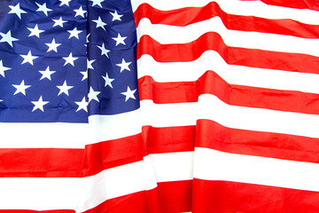 Natural fabric crumpled USA flag, rag American flag top view as texture or background, high resolution picture