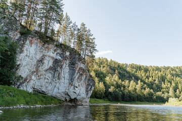 summer day on the river with rocky banks, blue sky, mountains, forest, landscape, river AI