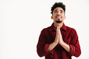 Poster - African young man showing pray please gesture