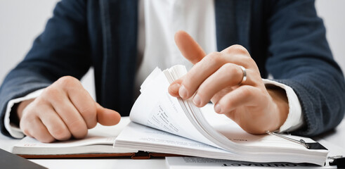 Cropped view of businessman works with financial papers at the table. Finance concept