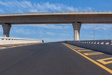 Travel Route New Road Highway Exit Entry Overpass Lanes  Standing Middle Of Empty Ramp Tarred Asphalt Road Panoramic Landscape With Blue Sky.