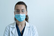 © rrudenkois - Doctor in safety glasses and mask.
