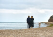 © Kulbabka - Couple with a dog by the sea