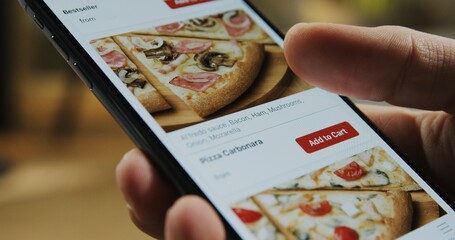 Smartphone fast food online ordering. Choosing pizza on mobile smart phone app.