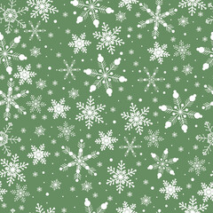 Seamless pattern of snowflakes on a green background vector illustration.