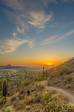 A Desert Trail On A Mountain Leading To A Sunset Over A Valley In Phoenix ARIZONA