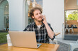 © Mego-studio - Young man talking on the phone.