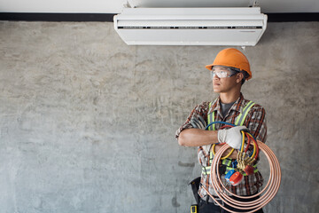 Air Conditioning Technician and A part of preparing to install new air conditioner. Technician vacuum pump evacuates and checking new air conditioner