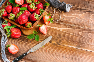 Wall Mural - Many ripe tasty strawberries on the wooden background. Copy space