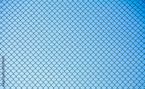 Cuadros en Lienzo Wire mesh steel on blue sky background