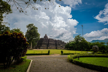 Wall Mural - Borobudur temple view with bright cloudy blue sky