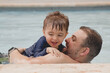 © Tamara Sales  - father and son in pool vacation Marriott  Stellaris Puerto Rico Condado beach
