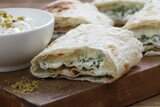 Fototapeta Tulipany - Pita bread stuffed with cottage cheese, herbs and spices
