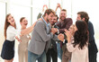 © ASDF - happy business team applauding the leader of a successful projec