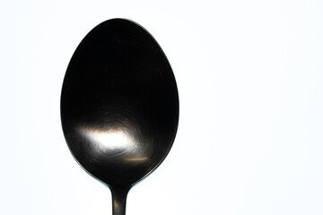 Silver spoon on a white background