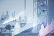 © peshkova - Double exposure of stock market graph drawing and office interior background. Concept of financial analysis.