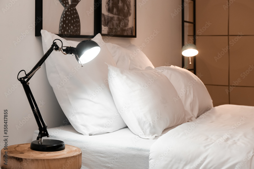 Interior of modern hotel room in evening