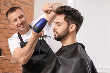 Wall Mural - Hairdresser working with client in salon