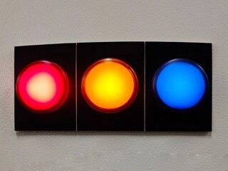 pilot lamp for showing 3 phase status of electricity by red yellow and blue lights installed on panel.