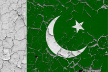 Pakistan Flag Close Up Grungy, Damaged And Scratched On Wall Peeling Off Paint To See Inside Surface. Vintage National Concept.