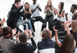 © ASDF - group of seminar participants applauds sitting in a circle